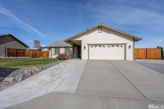 ranch-style home with a garage and a front yard