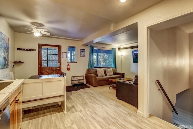 bedroom featuring multiple windows, ceiling fan, and light wood-type flooring