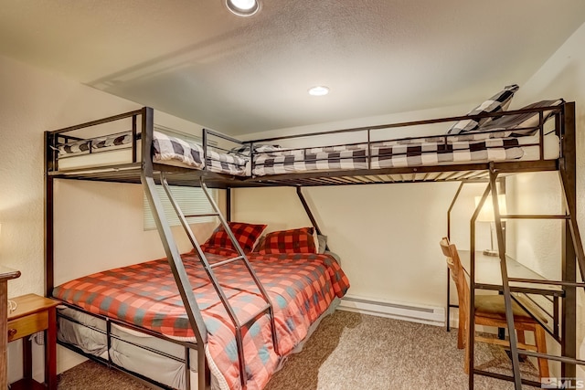 carpeted bedroom featuring a baseboard radiator