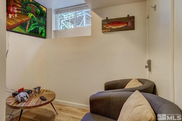 sitting room featuring light hardwood / wood-style flooring