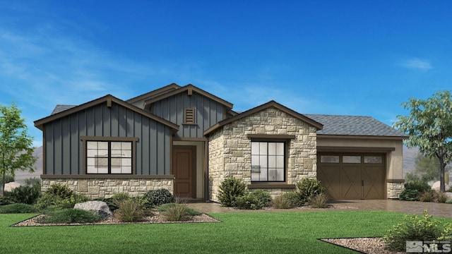 view of front of property with a garage and a front lawn