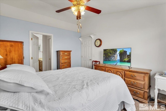 bedroom featuring ceiling fan and light carpet