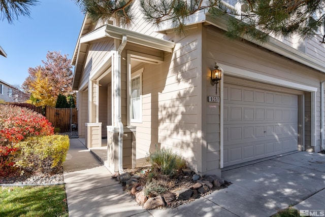 view of side of home featuring a garage