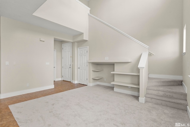 staircase featuring carpet flooring