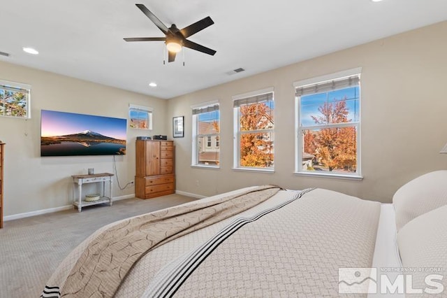 carpeted bedroom with ceiling fan