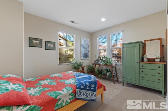 bedroom with light carpet