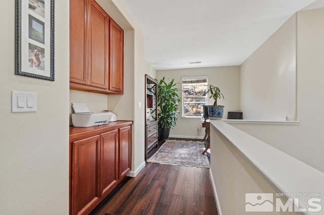 hall featuring dark wood-type flooring