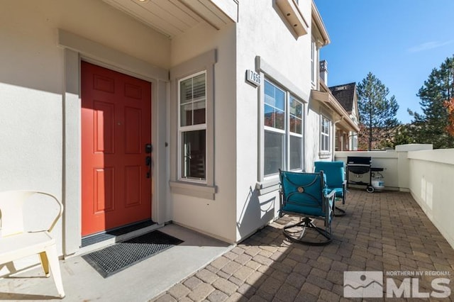 doorway to property with a porch