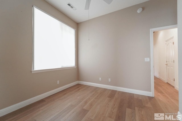 spare room featuring ceiling fan and light hardwood / wood-style flooring