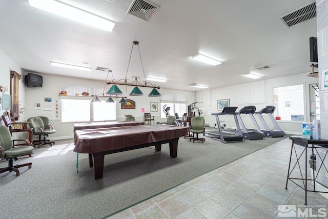 game room with plenty of natural light, light colored carpet, and pool table