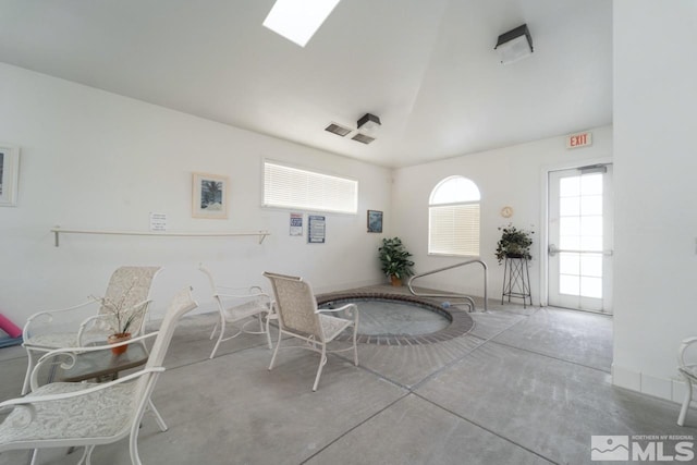 interior space featuring concrete flooring