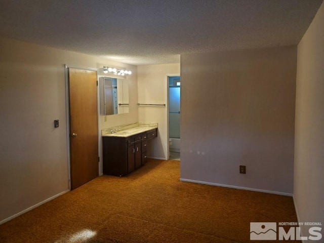 bathroom featuring vanity and a textured ceiling