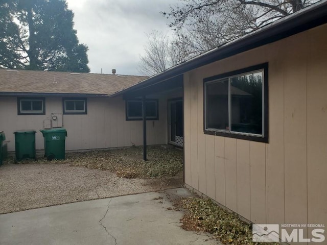 view of side of home with a patio