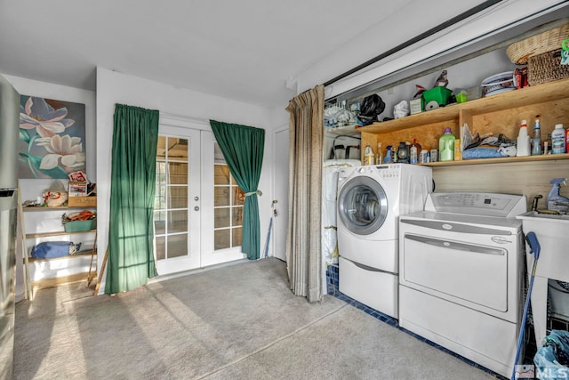 laundry area featuring french doors, light colored carpet, and washer and dryer