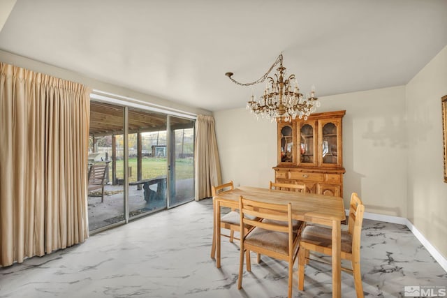 dining space with a chandelier