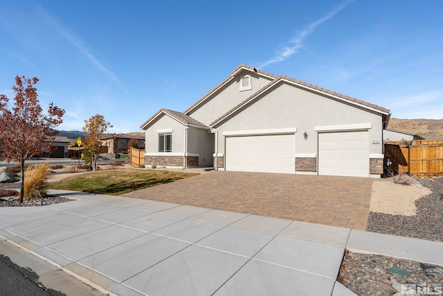 ranch-style home featuring a garage