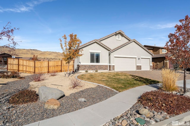 view of front of house featuring a mountain view and a garage