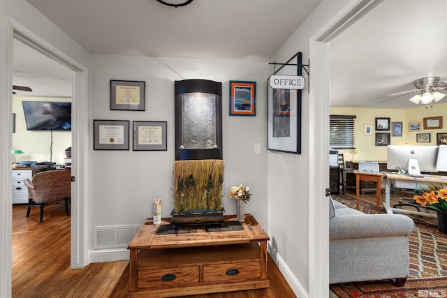 corridor featuring hardwood / wood-style floors