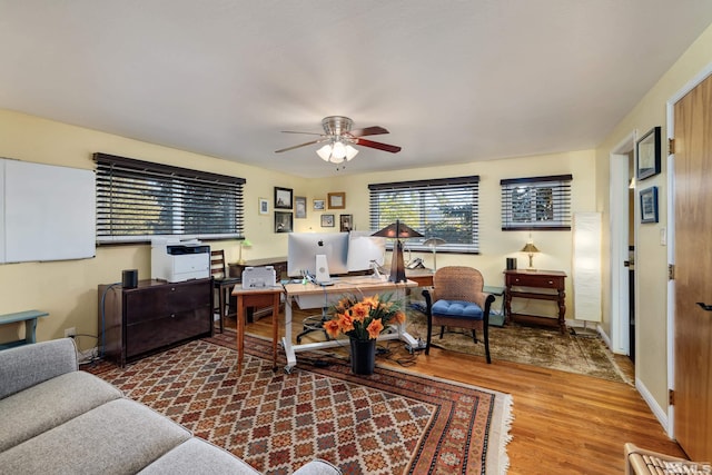 home office featuring ceiling fan and hardwood / wood-style floors