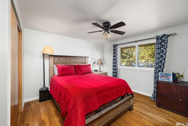 bedroom with wood-type flooring and ceiling fan