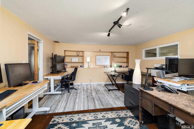 office space featuring a textured ceiling and dark wood-type flooring