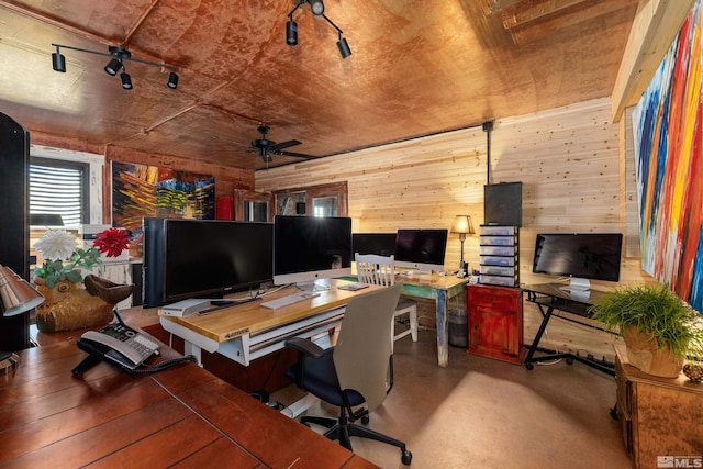 office space featuring wood walls, ceiling fan, and wood ceiling