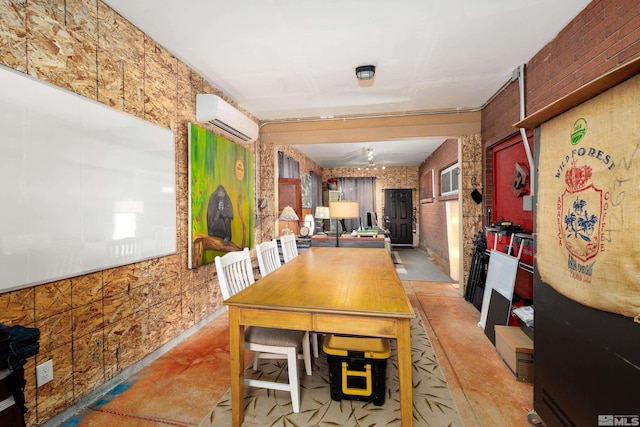 dining area featuring an AC wall unit and brick wall