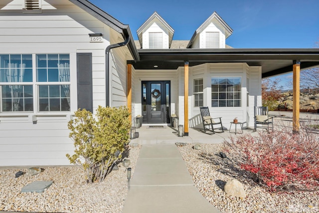 doorway to property with covered porch