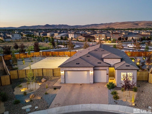 view of front of house with a mountain view and a garage