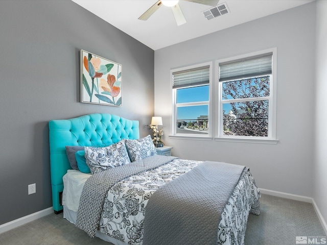 bedroom with ceiling fan and light carpet