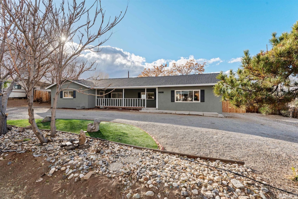 single story home with covered porch