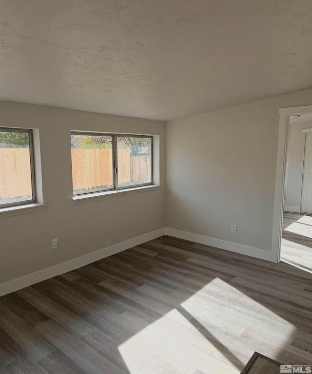 unfurnished room featuring hardwood / wood-style floors