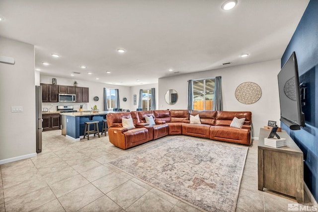 living room with light tile patterned floors