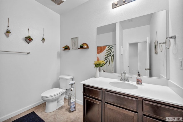 bathroom featuring tile patterned floors, a shower with curtain, vanity, and toilet