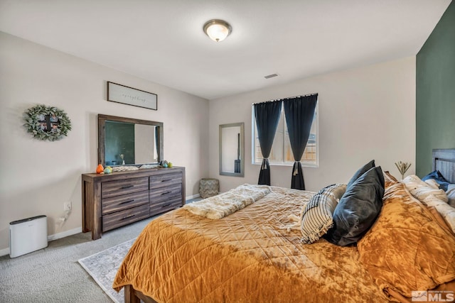 bedroom with light colored carpet