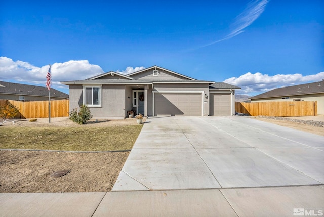 ranch-style house featuring a garage and a front lawn