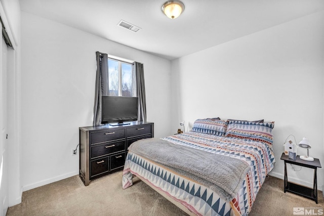 bedroom with light carpet