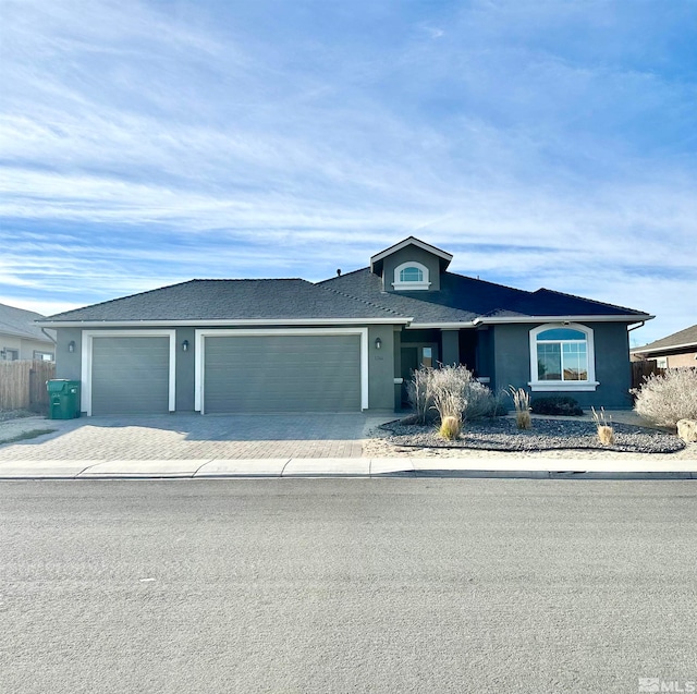 view of front of property featuring a garage