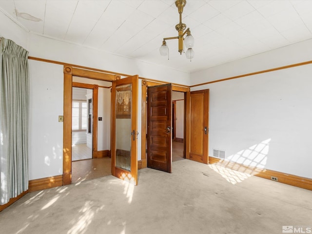 unfurnished bedroom featuring light colored carpet