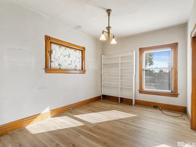 empty room with light wood-type flooring