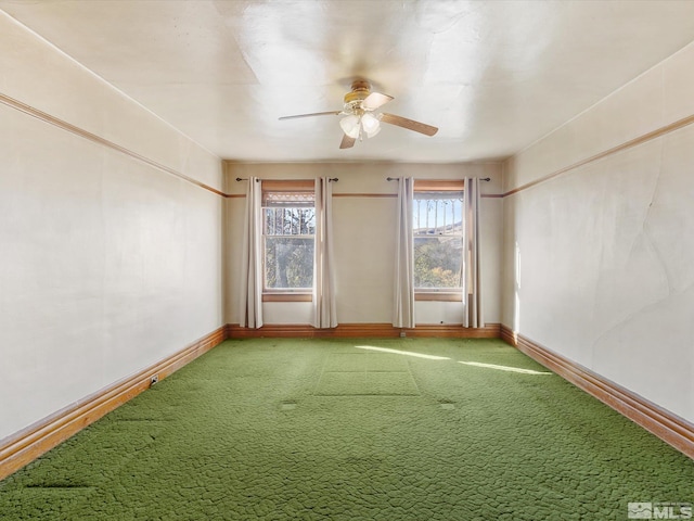 spare room featuring carpet flooring and ceiling fan