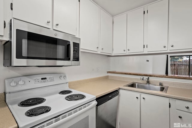 kitchen with white cabinets, sink, and stainless steel appliances