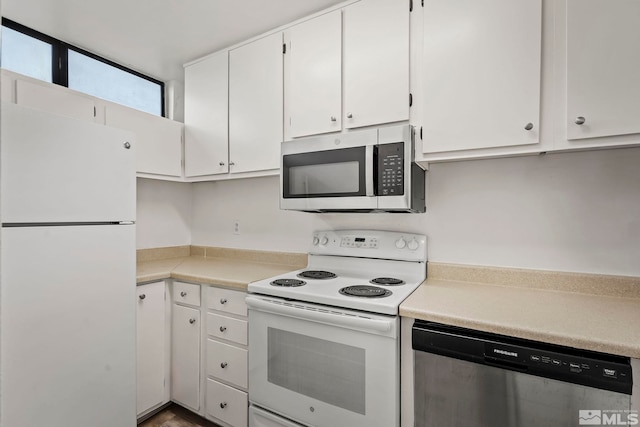 kitchen with appliances with stainless steel finishes and white cabinetry