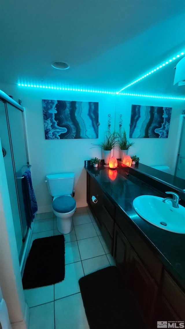 bathroom featuring tile patterned floors, vanity, and toilet