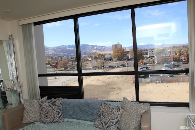 doorway to outside featuring a mountain view