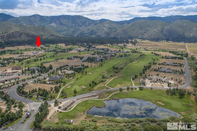 aerial view featuring a water and mountain view