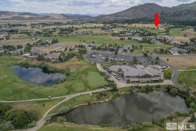 bird's eye view with a water and mountain view