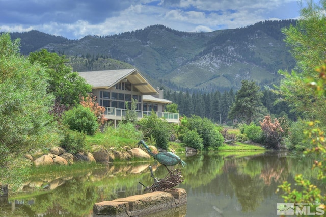 view of mountain feature with a water view