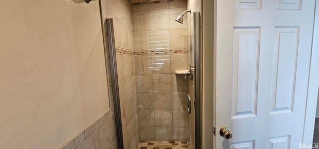 bathroom featuring an enclosed shower