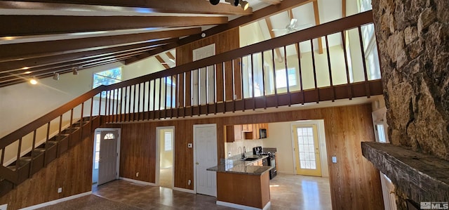 entrance foyer featuring ceiling fan, beam ceiling, sink, and high vaulted ceiling